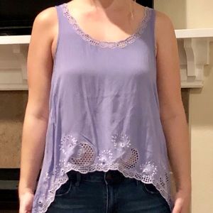 Asymmetrical tank top with cut outs